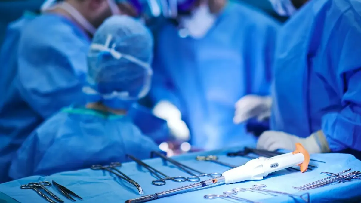 Surgical instruments and the Lexington Medical AEON stapler on an operating table