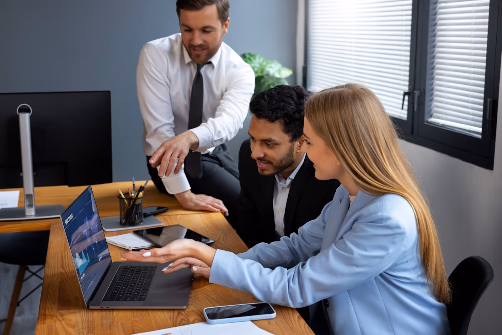 A group of workers processing orders with the help of AI