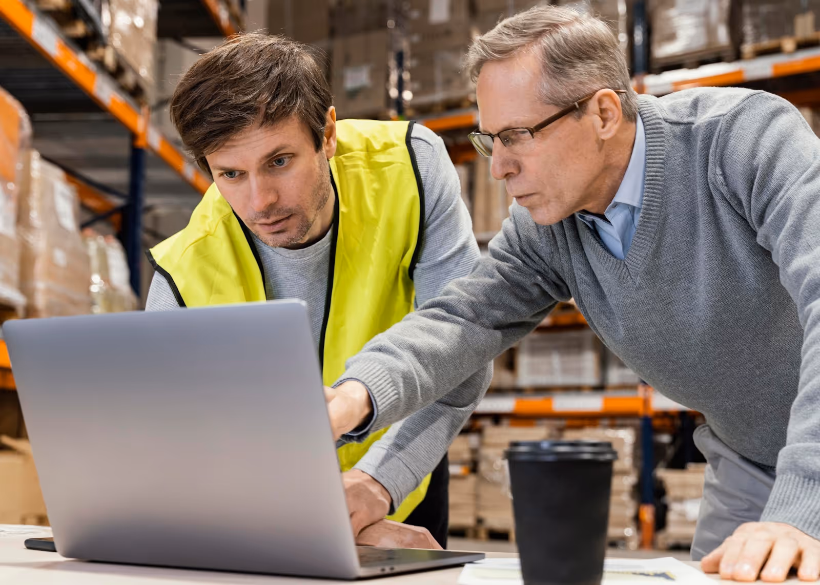 Two men working with AI for order processing