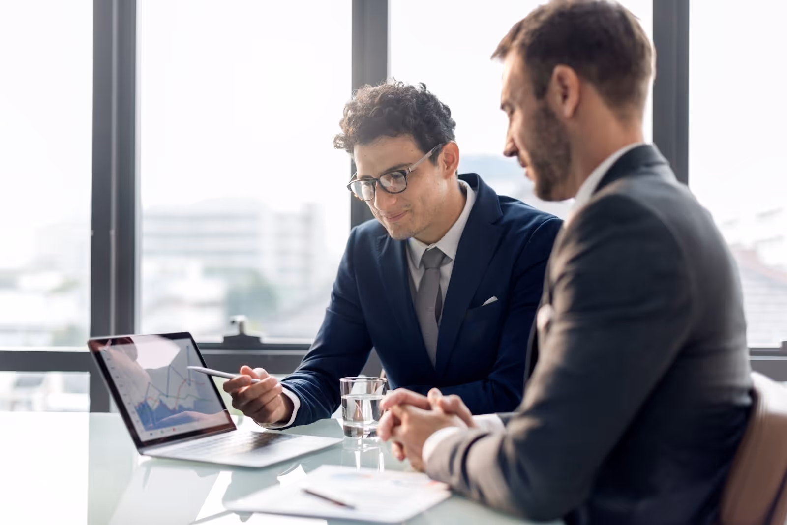 Men implementing an AI order processing system in a business