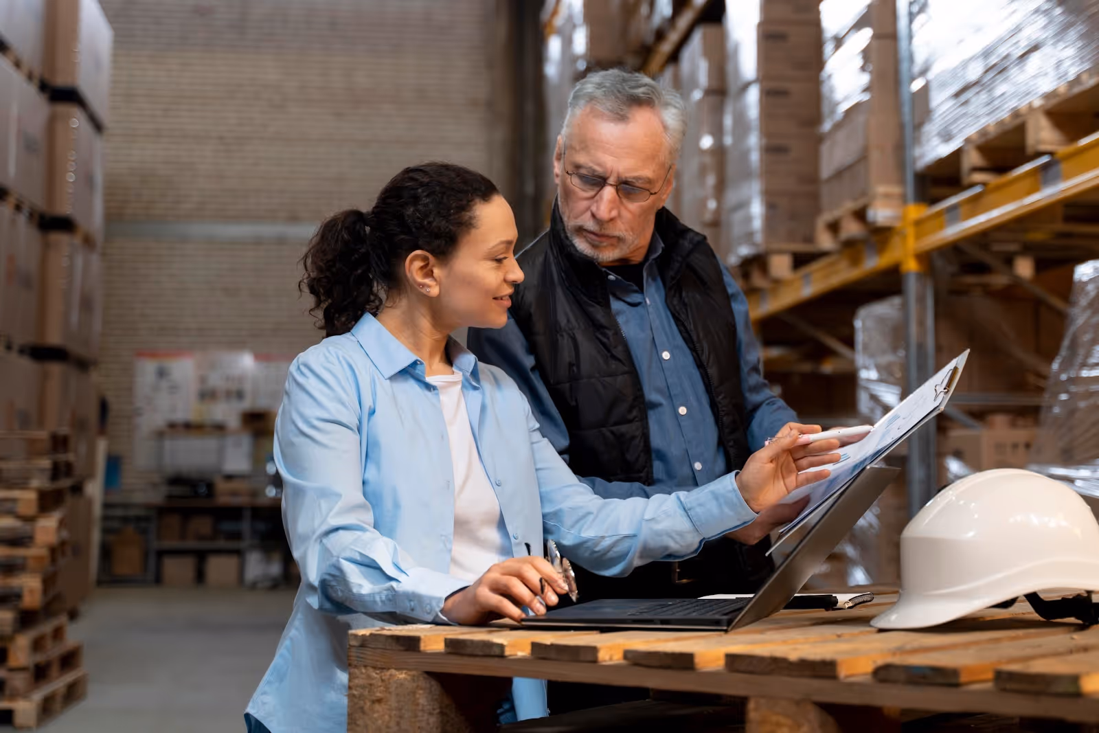 An image of two people trying to overcome operational procurement challenges.
